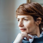 Woman looking out window