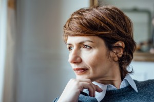 Woman looking out window