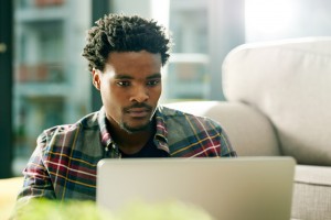 young african american man using computer