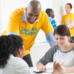 counselor helping young people at an employment program site