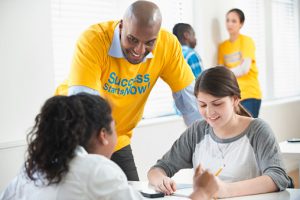 counselor helping young people at an employment program site