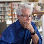 Man using computer to do career research.