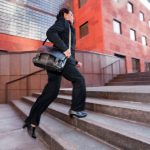 Business woman running up steps