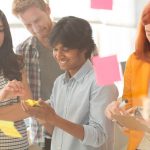 High school students looking at a phone
