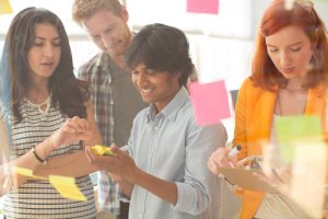 High school students looking at a phone