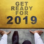 Man kneeling under words Get Ready For 2019