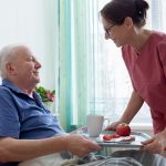 healthcare worker assisting patient