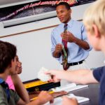African American male teacher with students
