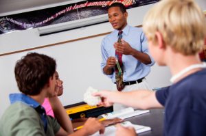 African American male teacher with students