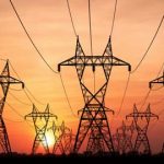 energy towers in sunset