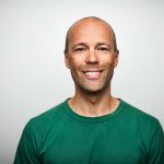 Portrait of mature man smiling on white background