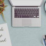 office desktop with revise rebrand and the rethink text on clipboard