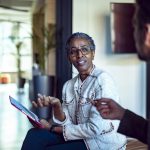 Black lady connecting with employee