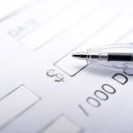 Blank paycheck with pen