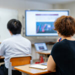 Adults learning in classroom